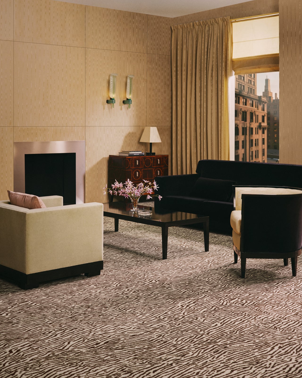 Close-up of the Animal wall-to-wall carpet in Beige/Walnut, showing the dense cut pile and organic animal motif.