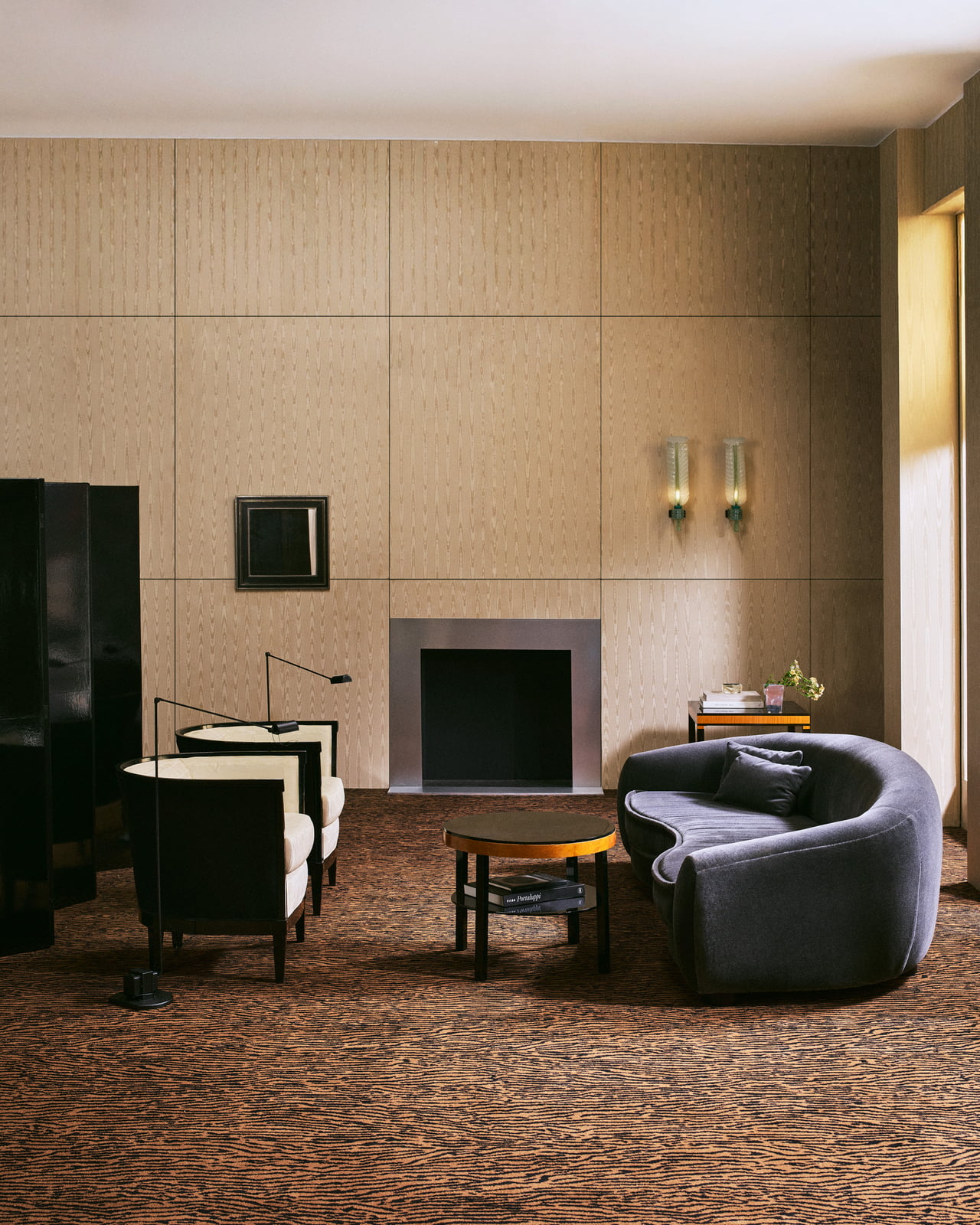 Close-up of the Animal wall-to-wall carpet in Pecan/Black, showing the dense cut pile with its organic animal-inspired motif.