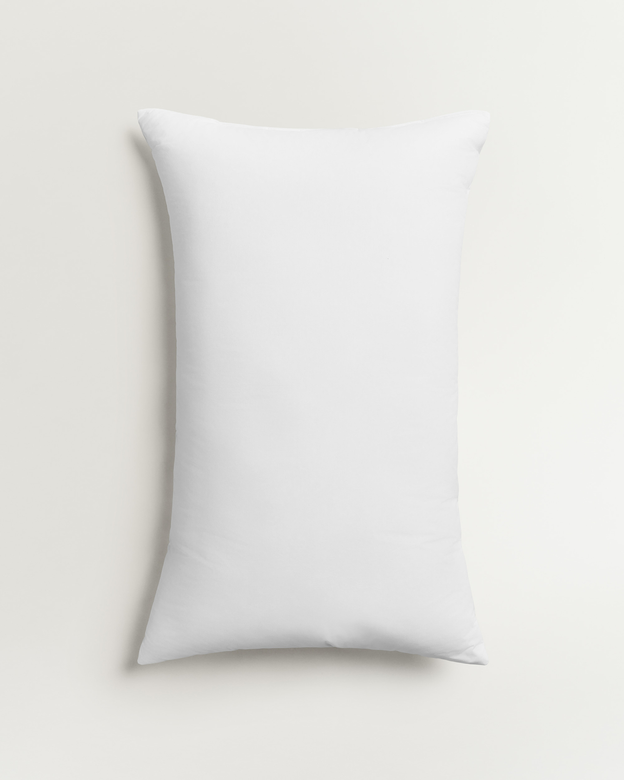 Down and Feather Pillow in White, a soft cotton pillowcase with a smooth finish.
